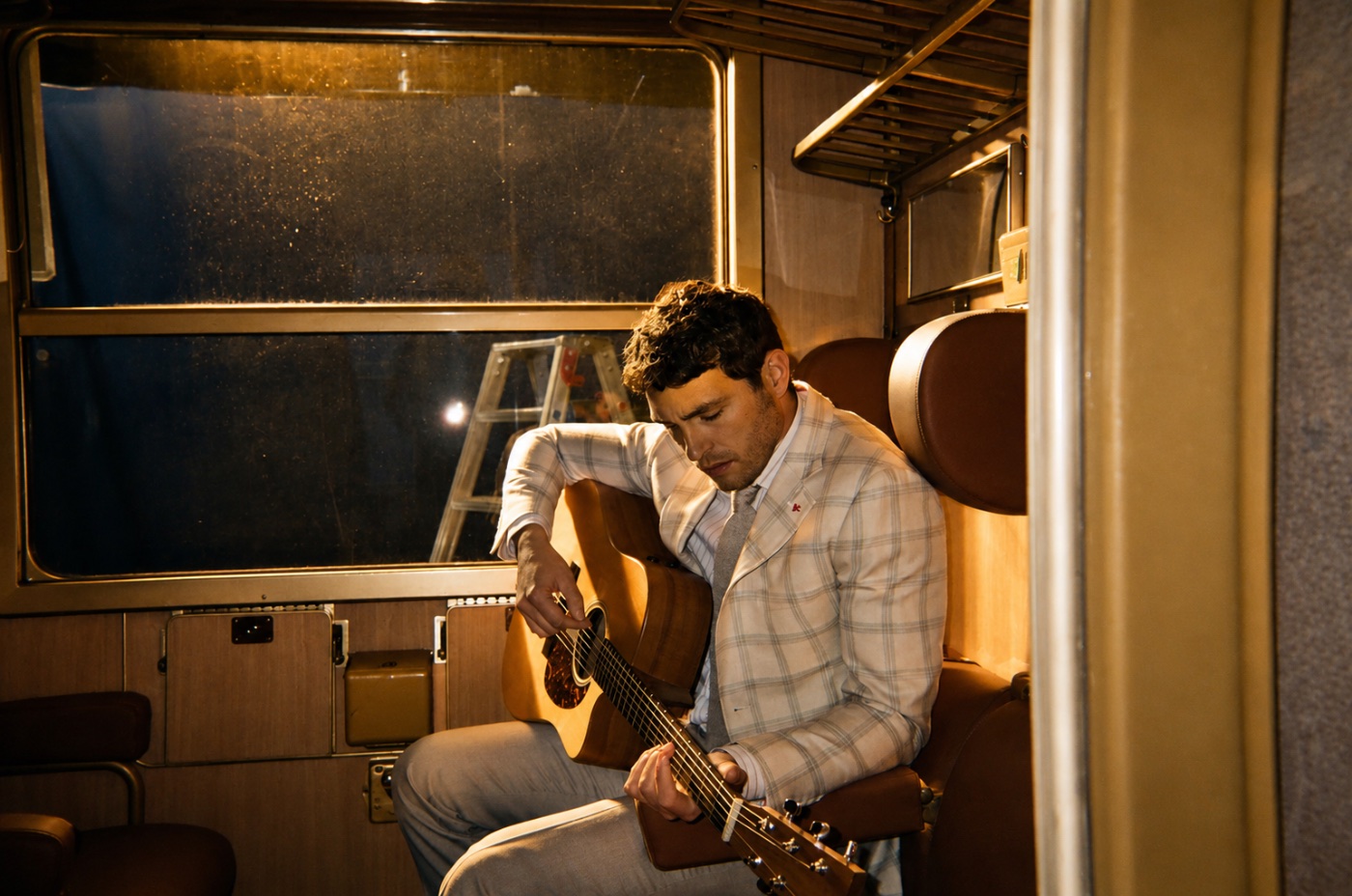 The lead with his guitar between takes