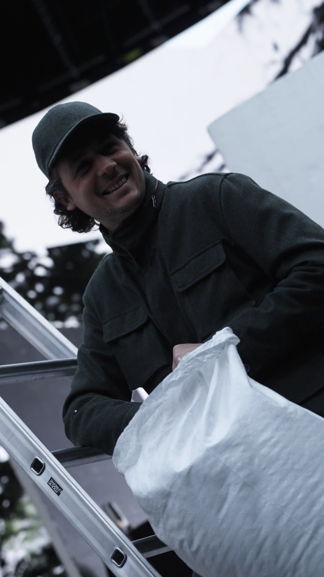 Crew member smiling on the ladder